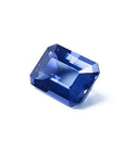 3.90 ct untreated GIA certified rectangular emerald-cut blue sapphire changing to purple.