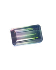 3.20 ct. emerald-cut loose watermelon Brazilian tourmaline gemstone with sparkling green and soft pink hues.