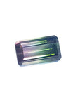 3.20 ct. emerald-cut loose watermelon Brazilian tourmaline gemstone with sparkling green and soft pink hues.