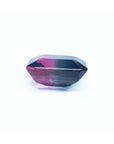 7.75 ct. emerald-cut Brazilian watermelon tourmaline gemstone with vibrant red-orange and deep bluish-green bicolor.