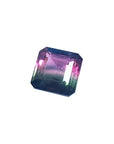 7.75 ct. emerald-cut Brazilian watermelon tourmaline gemstone with vibrant red-orange and deep bluish-green bicolor.