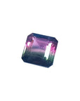 7.75 ct. emerald-cut Brazilian watermelon tourmaline gemstone with vibrant red-orange and deep bluish-green bicolor.