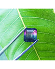 Emerald-cut Brazilian watermelon tourmaline gemstone with vibrant red-orange and deep bluish-green hues.