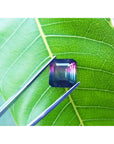 Emerald-cut Brazilian watermelon tourmaline gemstone with vibrant red-orange and deep bluish-green hues.