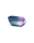 Loose 6.55 ct. emerald-cut Brazilian watermelon tourmaline, showing red, green, and blue hues.