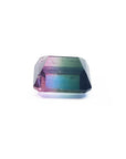 Loose 6.55 ct. emerald-cut watermelon tourmaline, showing red, green, and blue hues.