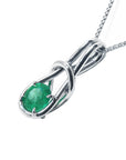 Right profile of this love knot emerald pendant, gallery underside view.
