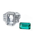 18K white gold diamond halo ring setting with baguette accents next to a vibrant emerald cut Colombian emerald.