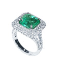 Natural colombian emerald ring for women with diamonds in 14k white gold.
