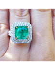 Natural colombian emerald ring GIA certified in a halo natural diamond crafted in 14k white gold.