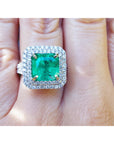 Natural colombian emerald ring GIA certified in a halo natural diamond crafted in 14k white gold.