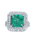 A double halo of natural diamonds encircling a square natural colombian emerald, 14k white gold ring