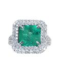 4.14 ct GIA F1 Colombian emerald ring with diamond halo and band in 14K white gold.