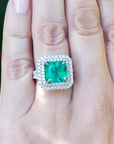 4.14 ct GIA-certified F1 Colombian emerald ring with diamond halo in 14K white gold.