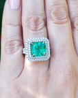 4.14 ct GIA-certified F1 Colombian emerald ring with diamond halo in 14K white gold.