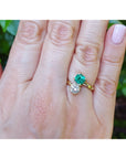GIA Certified Toi et Moi Emerald and Diamond Ring 18k Gold on a women's hand.