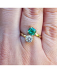 GIA-certified Toi et Moi emerald and diamond ring in 18k gold, featuring high-quality emerald engagement rings.
