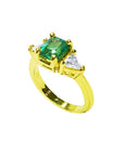 1.51 ct. emerald and trillion cut diamonds ring in 18k gold.