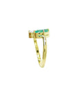 You and Me ring a marquise-cut emerald paired with a natural diamond accent, all set in 18K yellow gold.