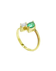This stunning You and Me ring showcases a marquise-cut emerald paired with a natural diamond accent.