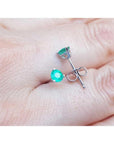 14K white gold martini stud earrings with round and pear-cut green emeralds, push backs.
