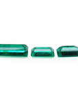 Matched trio set of baguette-cut natural Colombian emeralds with vibrant deep bluish-green color.