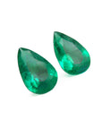 Matched pair set loose emeralds pear cut 3.62 ct. front left side table-crown view