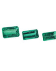 Three emerald-cut natural Colombian emeralds, varying in size, for earrings and pendant.