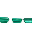 Three emerald-cut natural Colombian emeralds, a matched set for earrings and a pendant.