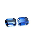 Natural blue sapphires matching pair emerald-cut for earrings, right position, displaying tables and crowns