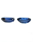 Matching pair of 2.09 ct. emerald-cut blue sapphires, ideal for earrings.