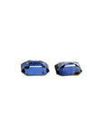 Matching pair of 2.09 ct. emerald-cut blue sapphires, ideal for earrings.