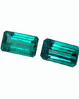 Emerald-cut matching pair loose emeralds from Muzo Colombia, left close side tables and crowns exposed