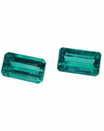 Emerald-cut matching pair loose emeralds from Muzo Colombia, left side tables and crowns exposed