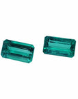 Matching pair of emerald-cut 3.38 ct. loose emeralds, fine quality, vibrant bluish medium deep green.