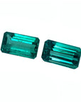 Emerald-cut matching pair loose natural emeralds from Muzo Colombia, eye clean vibrant bluish medium deep green color.