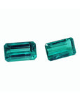 Emerald-cut matching pair loose emeralds from Muzo Colombia, right side tables and crowns exposed