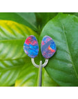 Matching pair of 4.72 ct Australian doublet opals with vibrant red, blue, and green flashes.