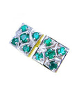 Pair of natural emerald cufflinks topside profile view on a white background