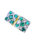 Pair of natural emerald cufflinks topside profile view on a white background