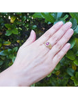 Men's 18K yellow gold ring with a prong-set oval pinkish-red Burma ruby.