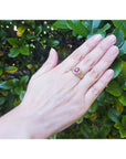 Men's 18K yellow gold ring with a prong-set oval pinkish-red Burma ruby.