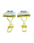 The downside profile view of a pair of yellow gold cufflinks foe men with real emeralds and diamonds/