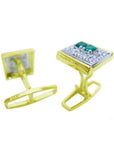 The underside view of a pair of cufflinks in yellow gold with real emeralds and diamonds.
