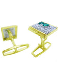 The underside view of a pair of cufflinks in yellow gold with real emeralds and diamonds.