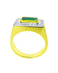 Gold ring for man with a rectangular emerald and diamond accents on a white background