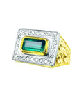 Men's 14K yellow gold ring with a rectangular bezel-set emerald surrounded by prong-set diamonds.