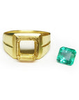 A yellow gold mounting ring with a loose colombian emerald aside to be set.