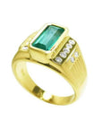 Men's 14K yellow gold ring with a rectangular Colombian emerald bezel set, flanked by burnish set diamonds.