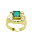 Men's 14K yellow gold ring with a cushion-cut emerald and diamond-studded horseshoe design.
